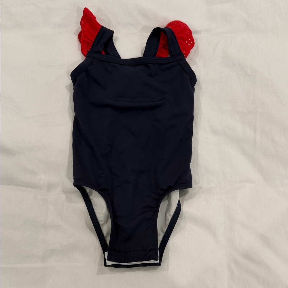 The Beaufort Bonnet Company Navy One-Piece Swimsuit with Red Ruffle Straps